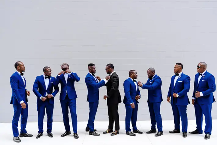 Portrait of groomsmen in bright blue tuxedos photographed by Kirth Bobb of the Beloved Agency, D.C.