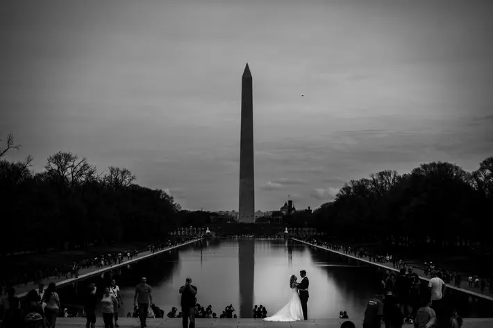 Bride and groom against national monument photography by Brea