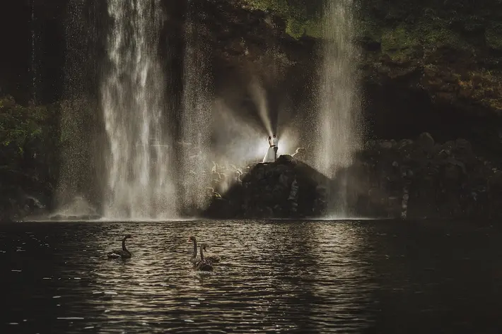 Couple at cascading waterfall Two Little Starfish