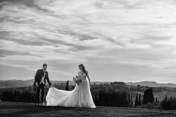 Antica di Fattoria couple portrait overlooking hills and vineyards Edoardo Agresti Photographers