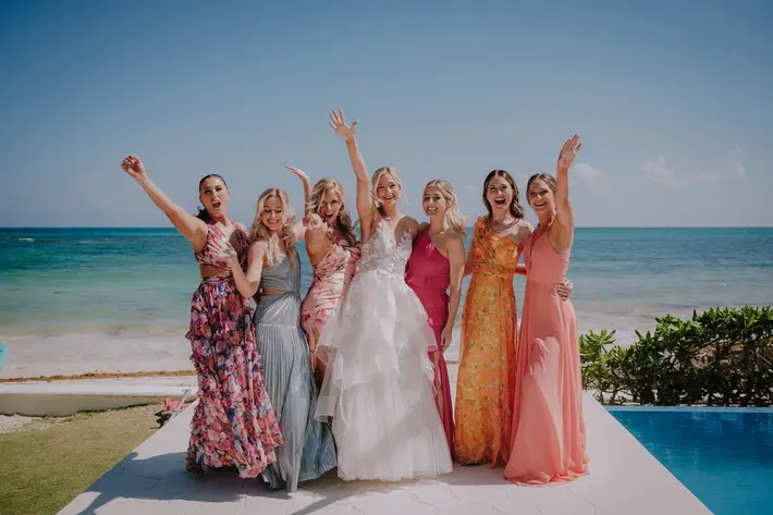 Pastel bridal party on tropical beach Ruben Chan Photography