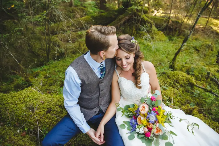 Bride and groom in mossy forest Satya Curcio Photography