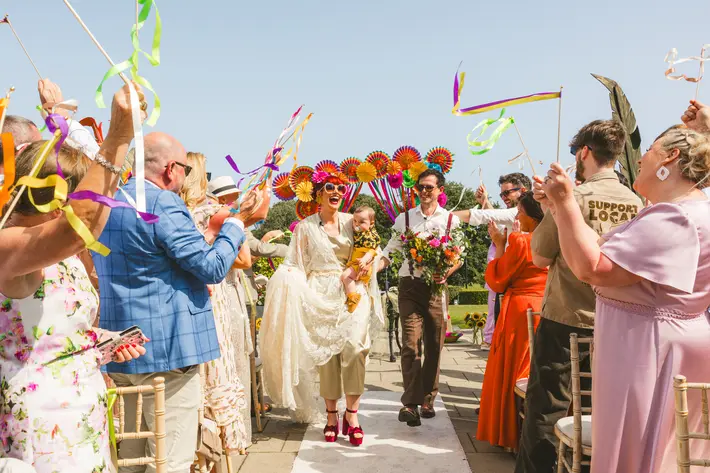 Alternative wedding style, colorful processional photographed by Katie Kav, Ireland wedding photographer
