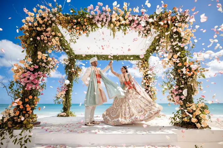 Indian couple ceremony with abundance of flowers photo by Gareth Davies