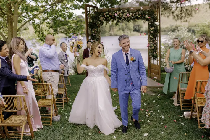 Happy outdoor recessional photographed by Pedro Filipe Fotografia, Portugal wedding photographer